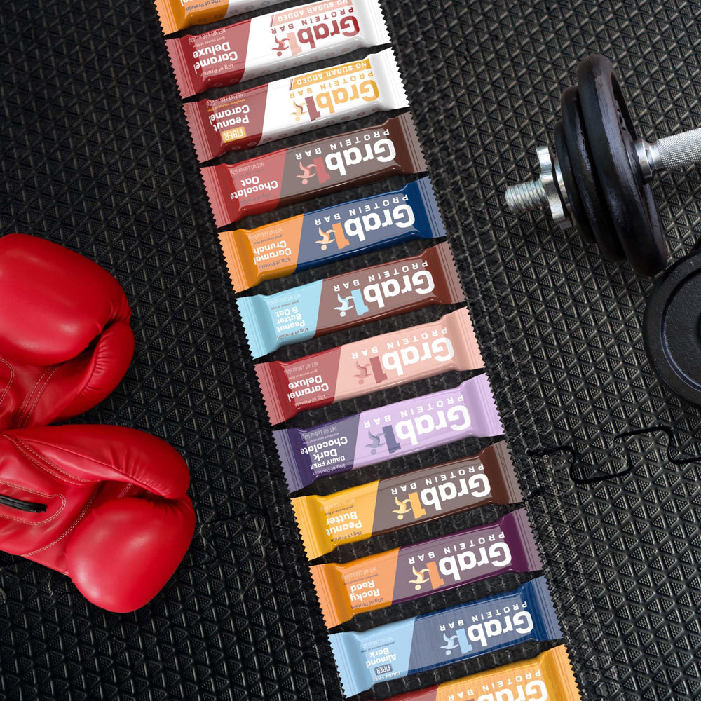 Grab1 Caramel Deluxe bar in hand suggests on-the-go nourishment between activities