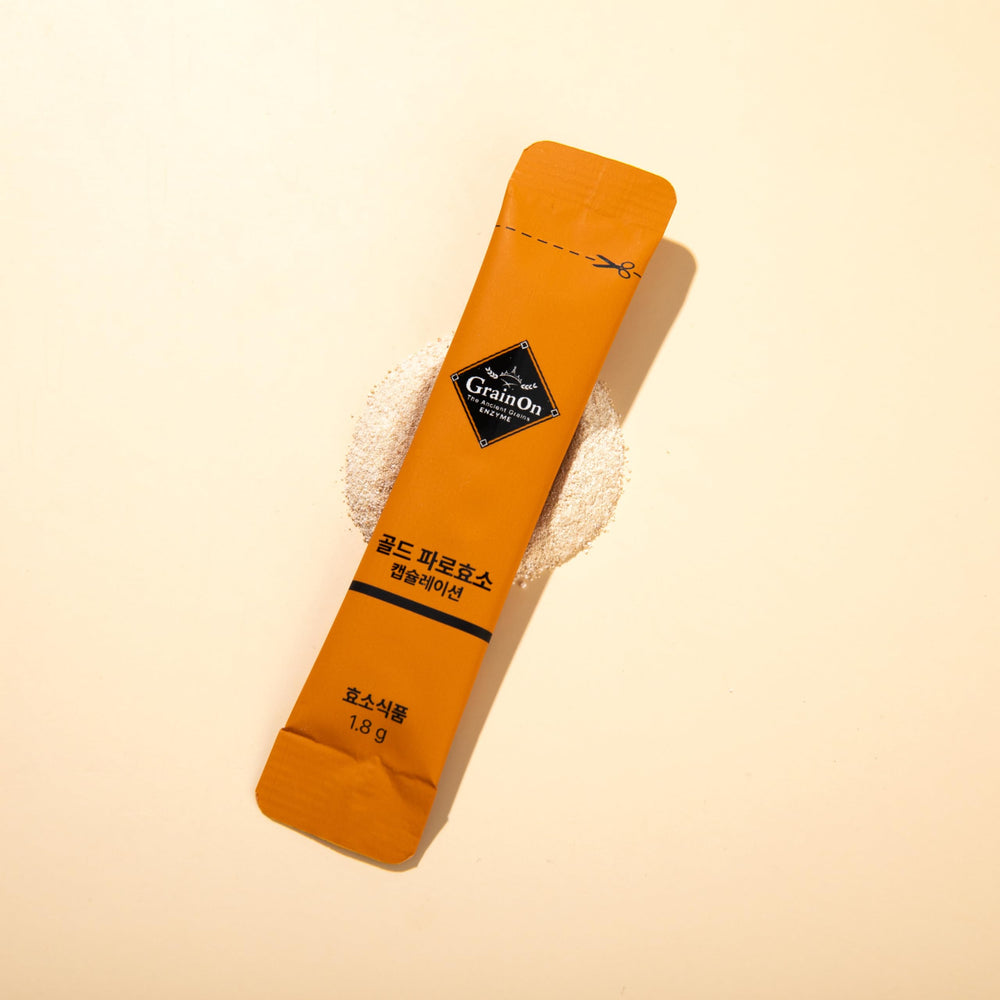 GrainOn Gold Farro enzyme stick with orange packaging highlights traditional grain fermentation