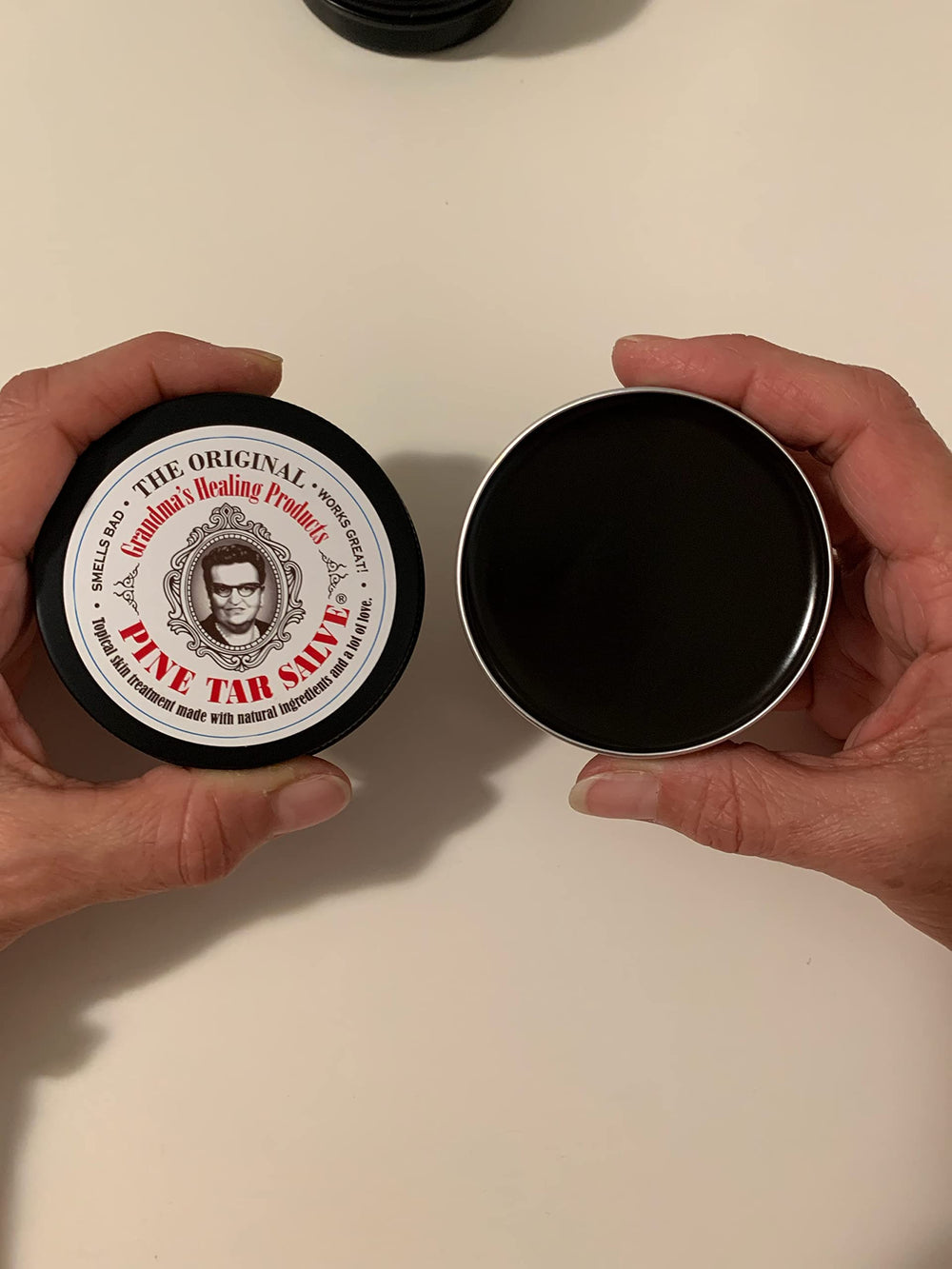Grandma's Pine Tar Salve applied on skin for minor comfort.