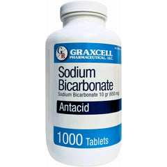 Graxcell sodium bicarbonate tablets 650mg bottle pour for quick heartburn relief on the go.