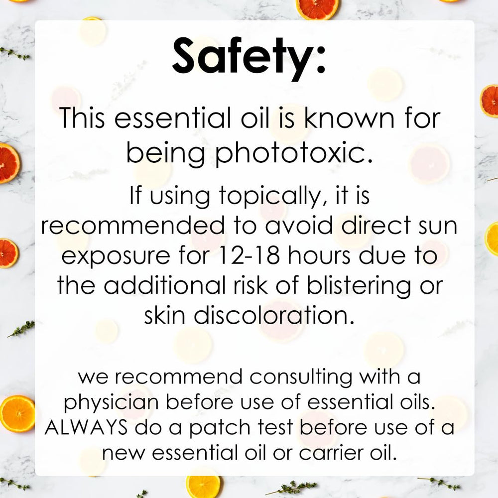 GreenHealth Orange 5X essential oil bottle on table in cozy setting