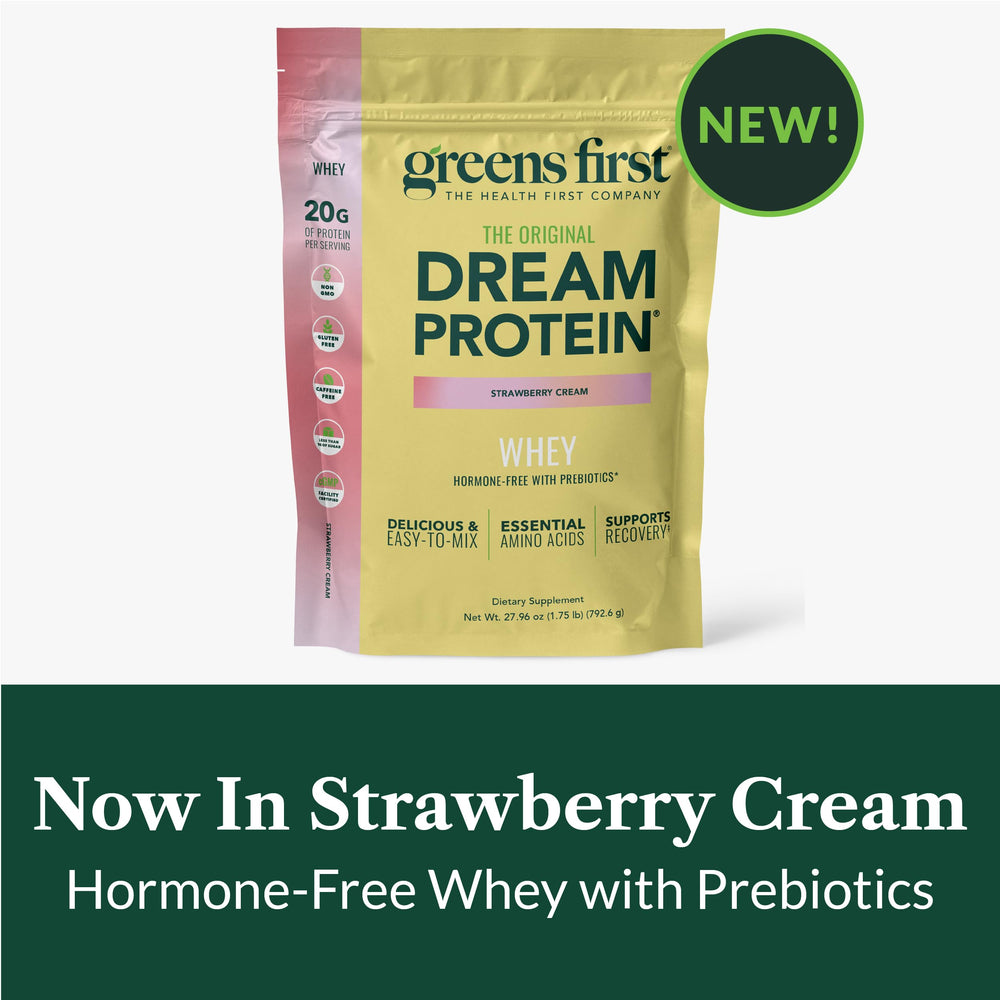 Greens First Dream Protein Whey strawberry-cream flavor close-up jar and scoop