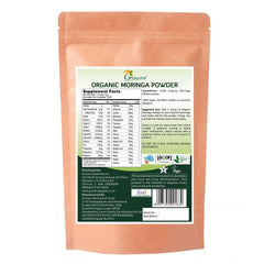 Grenera Moringa Powder on kitchen counter with measuring spoon.