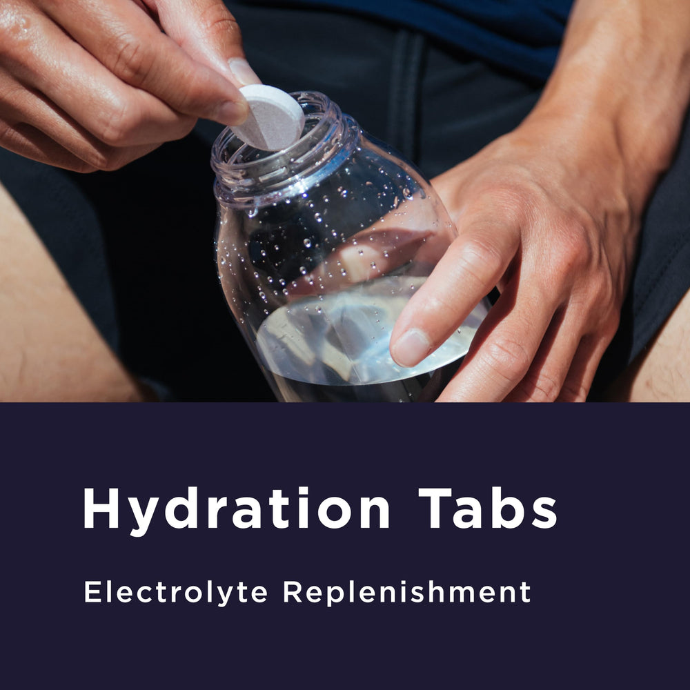 Dissolving GU Energy Hydration tablet in 16 ounces of water during a workout