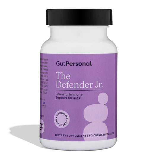 GutPersonal Defender bottle closeup showing capsules for daily immune support.