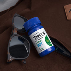 Habitrol mint lozenge dissolving in mouth for fast craving relief.