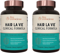 Hair La Vie Live Conscious bottle pouring capsules for daily hair support.