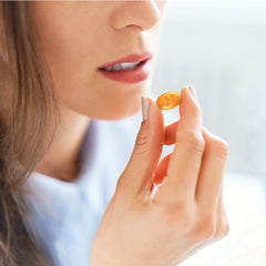 Closeup of HALLS Defense citrus drops bag reveals vibrant flavor identity