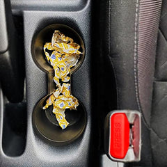 HALLS Defense on-the-go vial beside a cup of tea.
