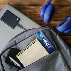 HALLS Mentho-Lyptus drops in travel packs; purse-friendly convenience.
