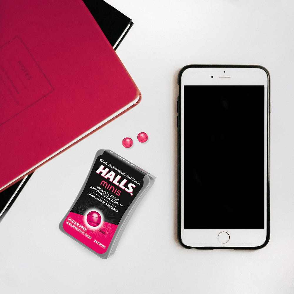 HALLS Minis Watermelon drops discreet use at desk.