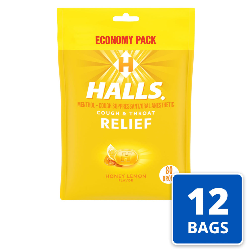 HALLS Relief Honey Lemon drops in hand show portability.
