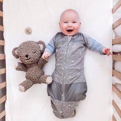 Happiest Baby SNOObear travel strap secures the soothing companion in motion.