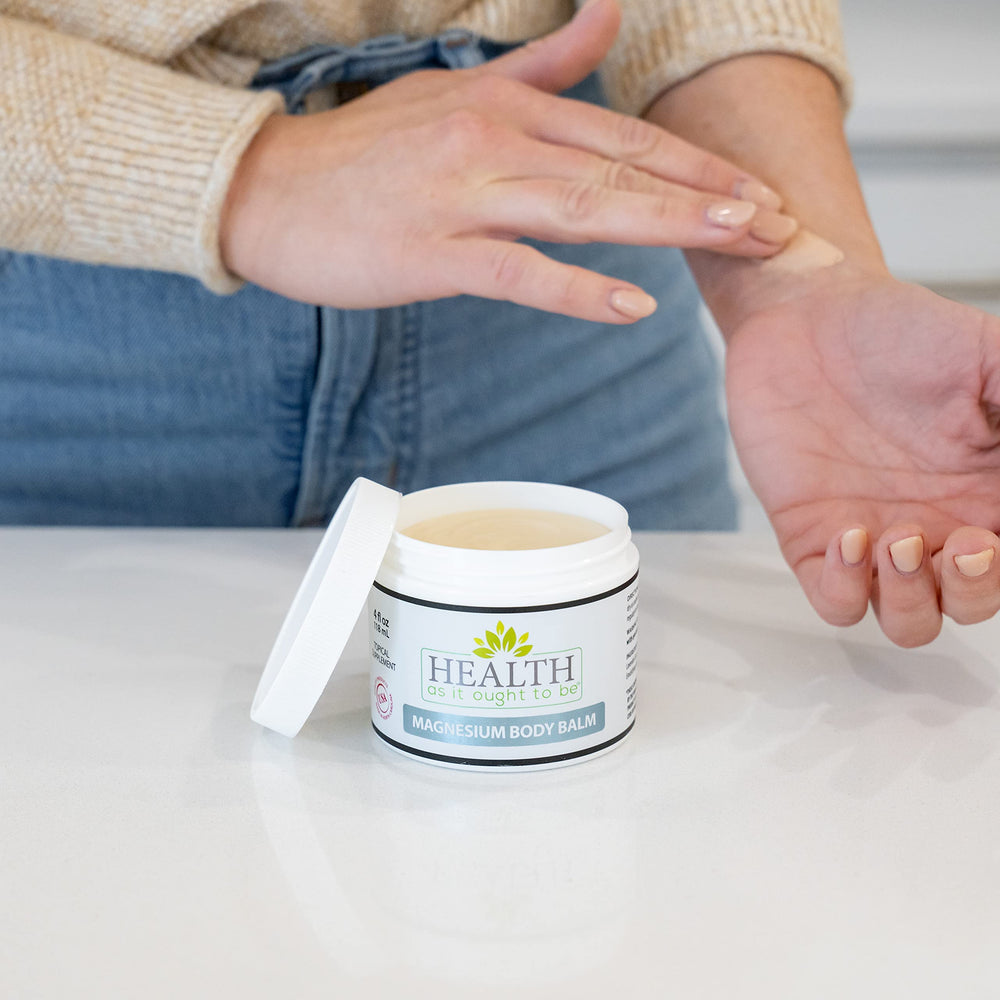 Health As It Ought To Be magnesium balm tub close-up showing creamy texture