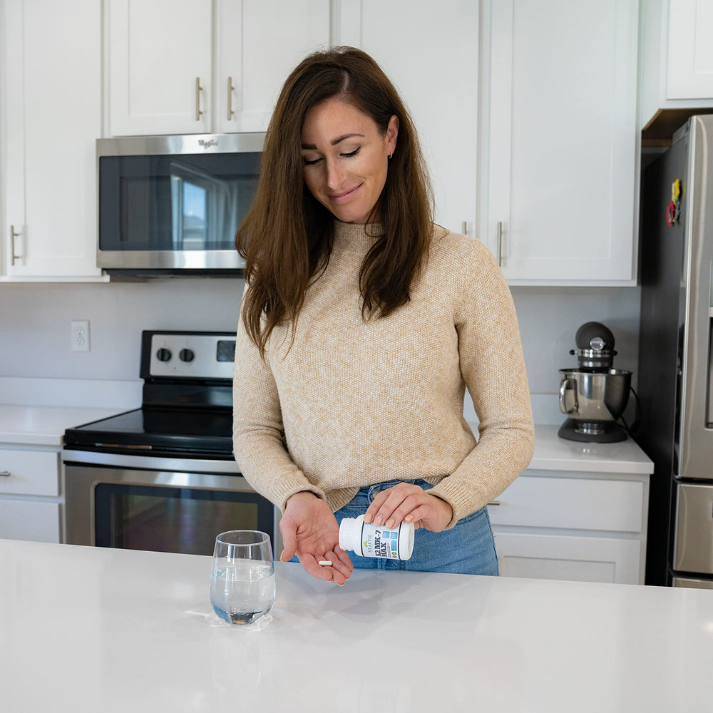 Health As It Ought To Be Vitamin K2 MK-7 Max bottle with glass of water for bone support
