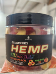 Healthergize Peach Ring Gummies with glass of water for daily calm