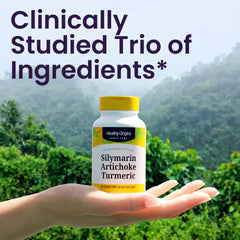 Healthy Origins Silymarin Artichoke Turmeric capsules in hand suggest daily digestion support.