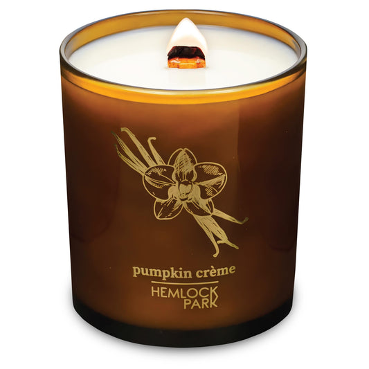 Hemlock Park Amber & Gold Wood Wick Candle with coconut wax, creates cozy ambience.
