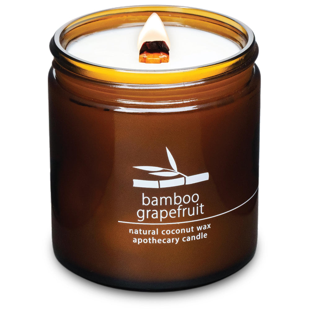Hemlock Park crackling wood wick candle 16 oz in bamboo grapefruit scent for cozy evenings.