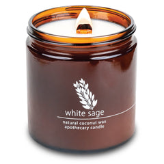 Hemlock Park crackling wood wick candle emitting a cozy glow