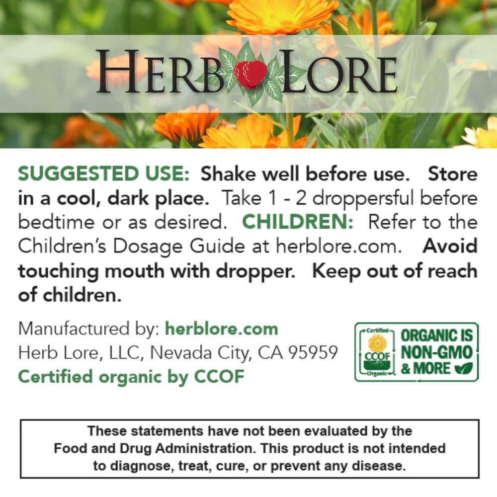 Glass of water beside Herb Lore GoodNight bottle for easy use.