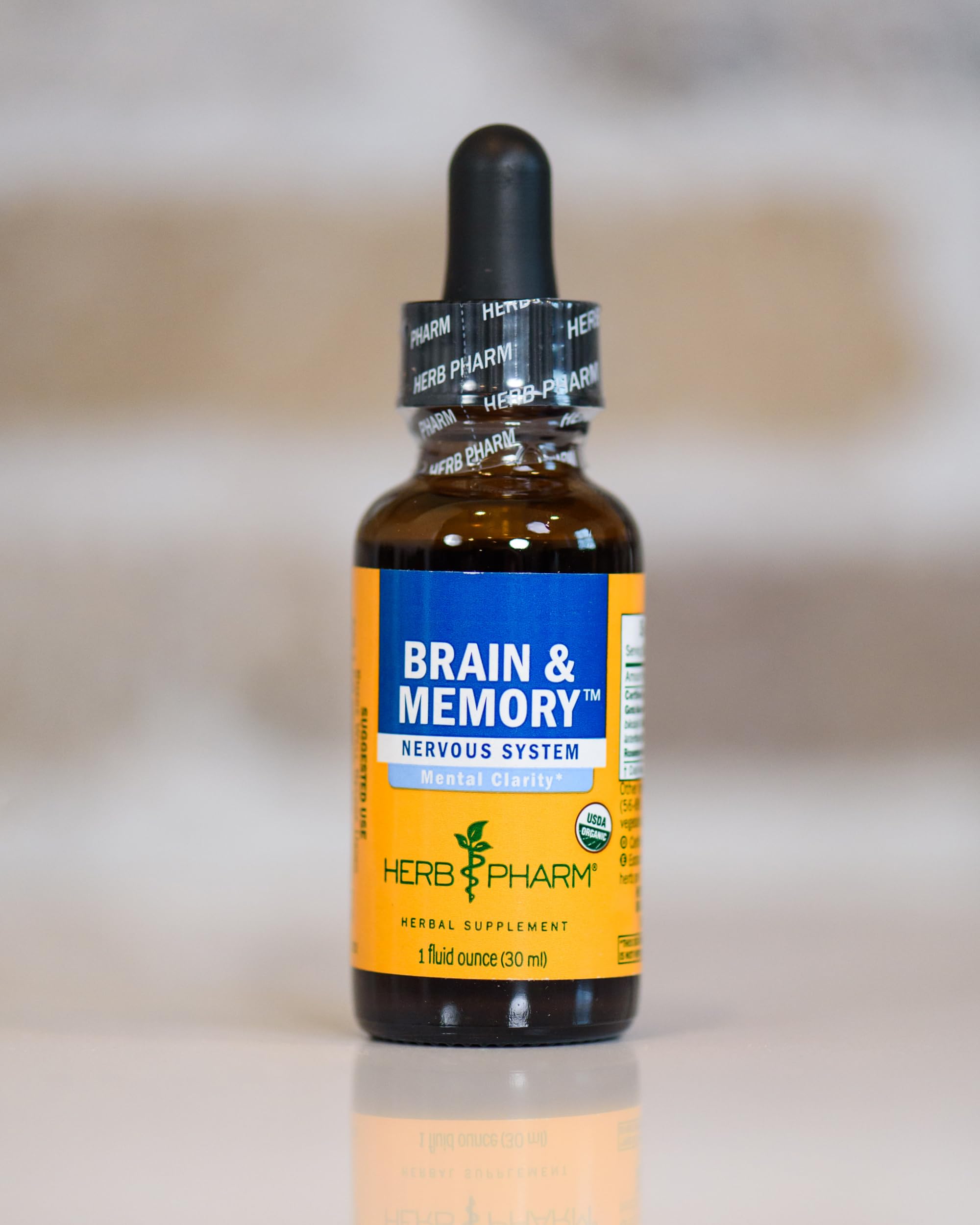 Herb Pharm Brain and Memory liquid vial ready for daily use on a kitchen counter.