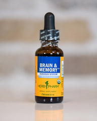 Herb Pharm Brain and Memory liquid vial ready for daily use on a kitchen counter.