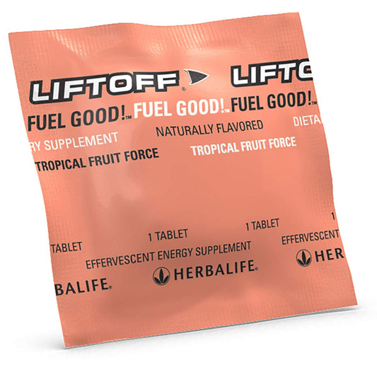 Herbalife Liftoff Tropical Fruit Force tablets dissolving in water for refreshing fizz.