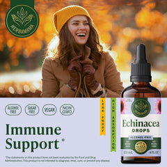 HERBAMAMA Echinacea tincture dropper dispersing into a glass for daily use.