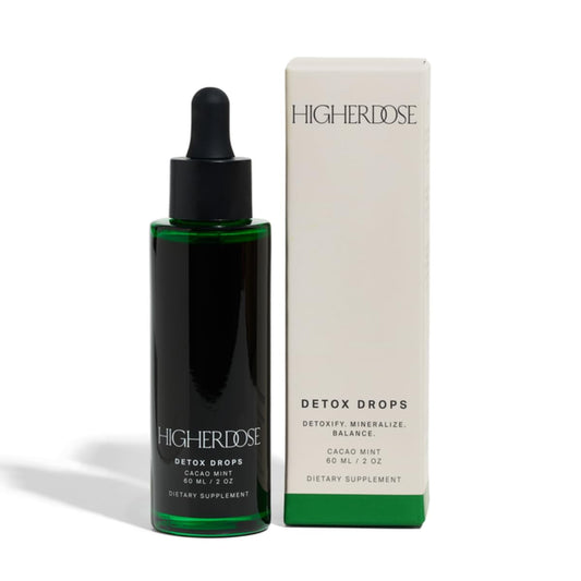 HigherDOSE Detox Drops bottle close-up highlighting plant-powered detox support.