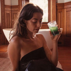 HigherDOSE Detox Drops being added to water for a refreshing detox ritual.