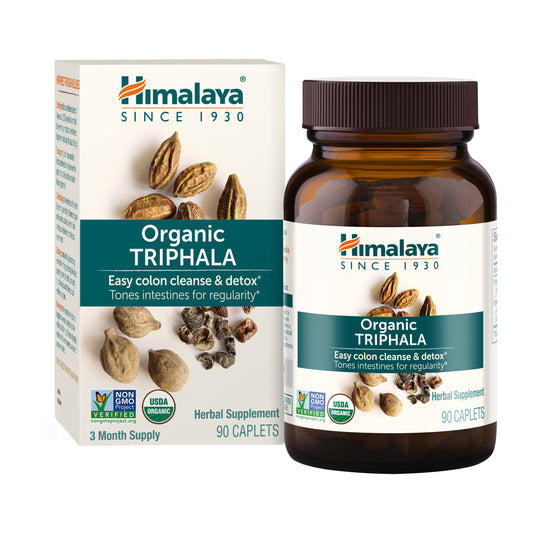 Himalaya Triphala bottle pour showing gentle digestive support at home.