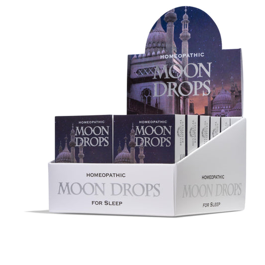 Historical Remedies Moon Drops bottle on a nightstand for easy bedtime use.