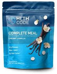 HLTH CODE Complete Meal Shake vanilla pour showing creamy texture for sustained energy.