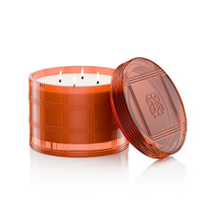 Ambient glow from HomeWorx Hot Cider Donut candle in a cozy room