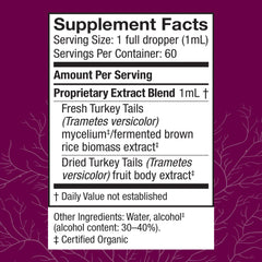 Host Defense Turkey Tail Extract dropper dispensing a measured dose for gut balance.