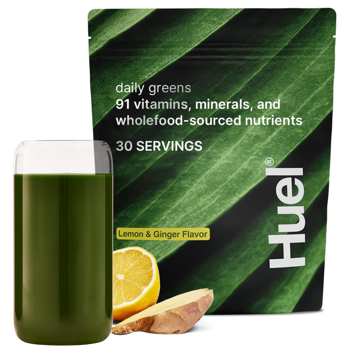 Huel Daily Greens lemon-ginger tub front for convenient daily nutrition.