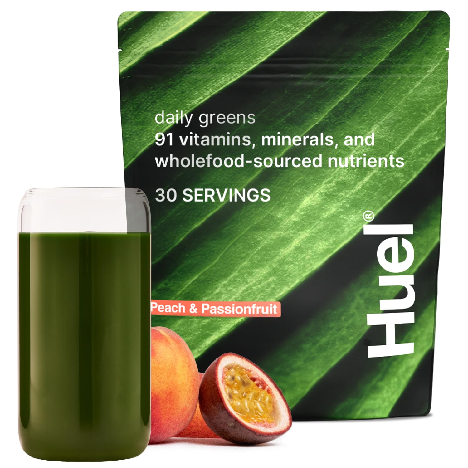 Huel Daily Greens Peach Passionfruit tub for daily nutrition on the go.