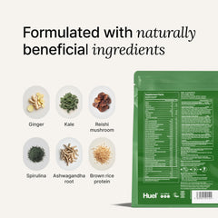 Huel measuring scoop beside glass of vanilla shake emphasizing protein and fiber support.