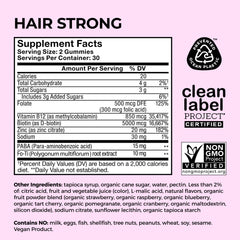 Hum Hair Strong bottle on vanity, part of a healthy hair routine.