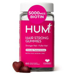 Hum Hair Strong bottle pour; tasty gummies support hair resilience.