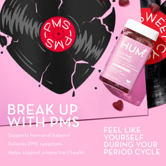 HUM SOS PMS Gummies on a desk suggest daily routine ease.