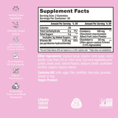 HUM SOS PMS Gummies packaging on display emphasizes vegan, gluten-free formula.