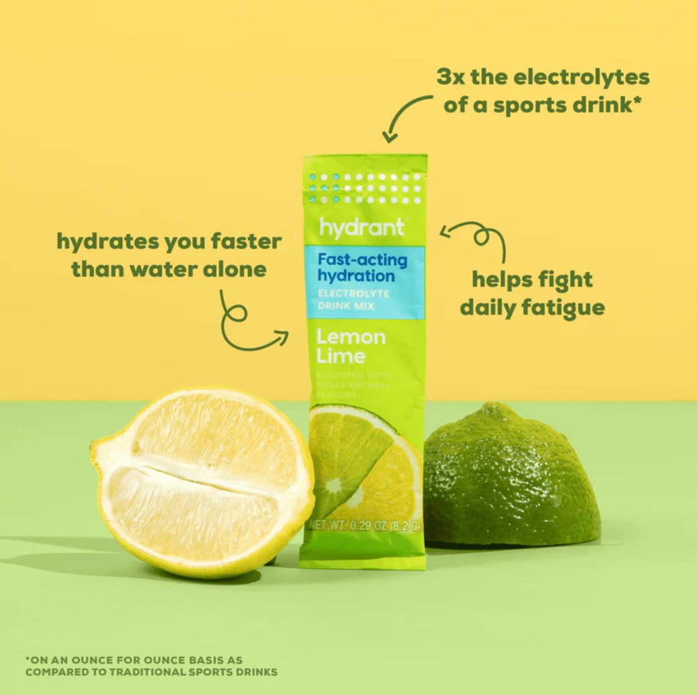 Hydrant Hydrate lemon lime powder scoop with glass of prepared drink.