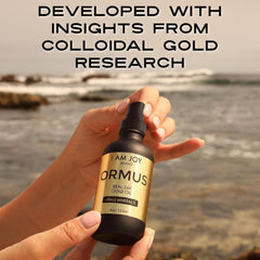 I Am Joy Co. Ormus Gold Oil 24k gold shimmer signaling luxury mineral content.