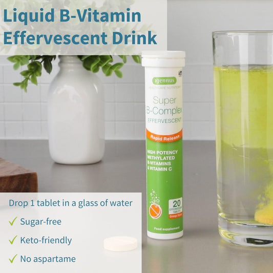 Igennus Super B-Complex orange flavor drink in a glass.