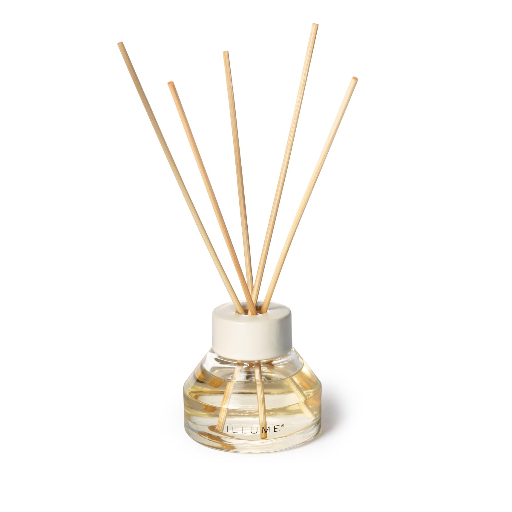 Illume diffuser held in hand demonstrates compact footprint for cozy spaces.