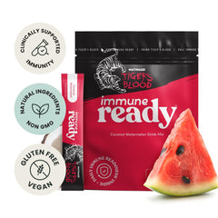 Immune Ready electrolyte packet being poured into water for quick hydration.