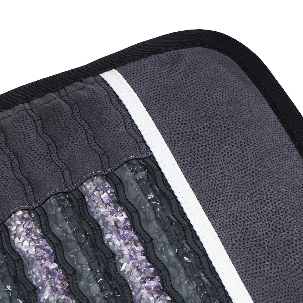 Close-up of amethyst-tourmaline chambers showing crystal energy and soothing heat.