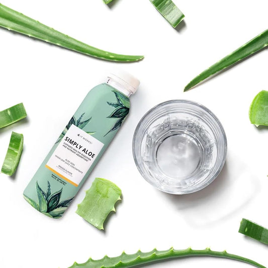 It Works! Simply Aloe Mango pour shows a tasty mango-flavored aloe drink for hydration.